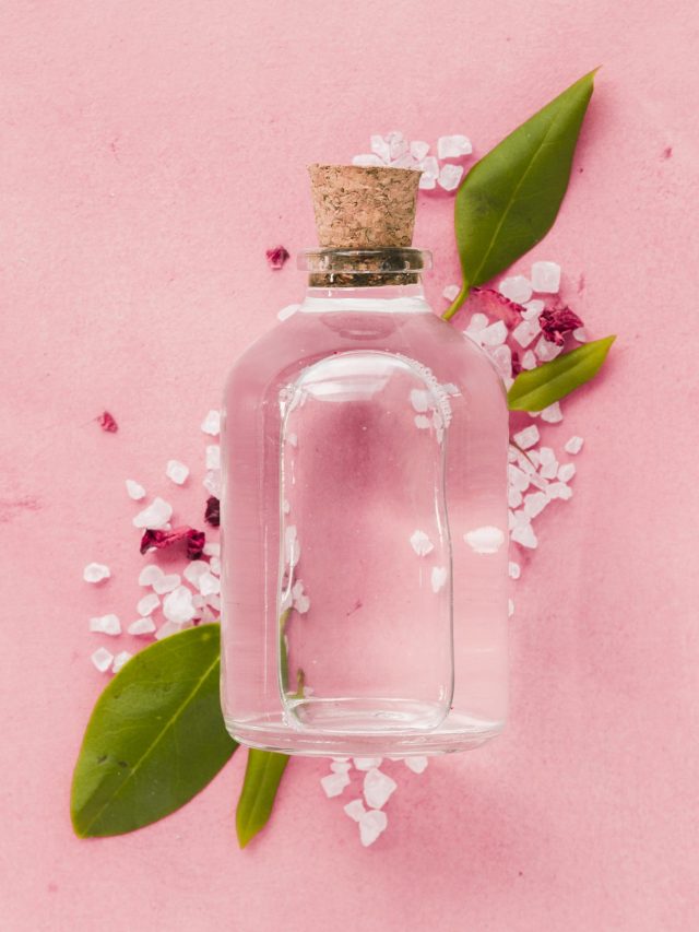 close-up-glass-container-pink-background