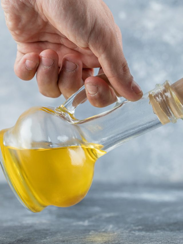 Man trying to openi bottle of oil